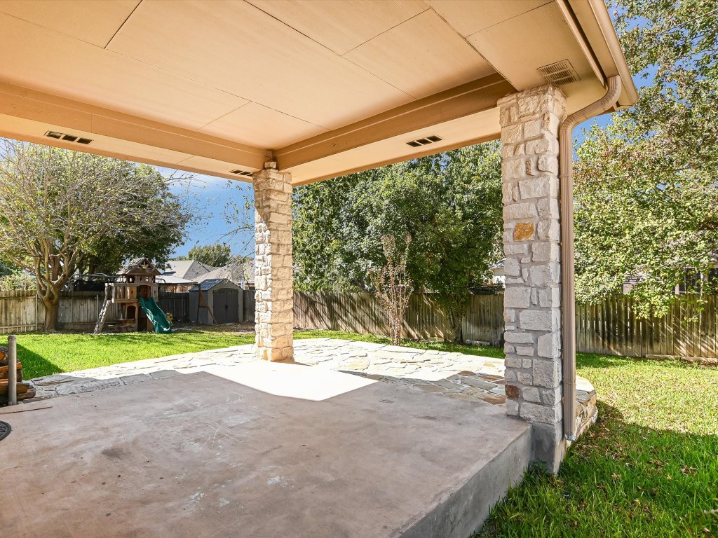 19910 Kennemer Drive Pflugerville, TX 78660 - Photo 18 of 21 a view of a road with a big yard