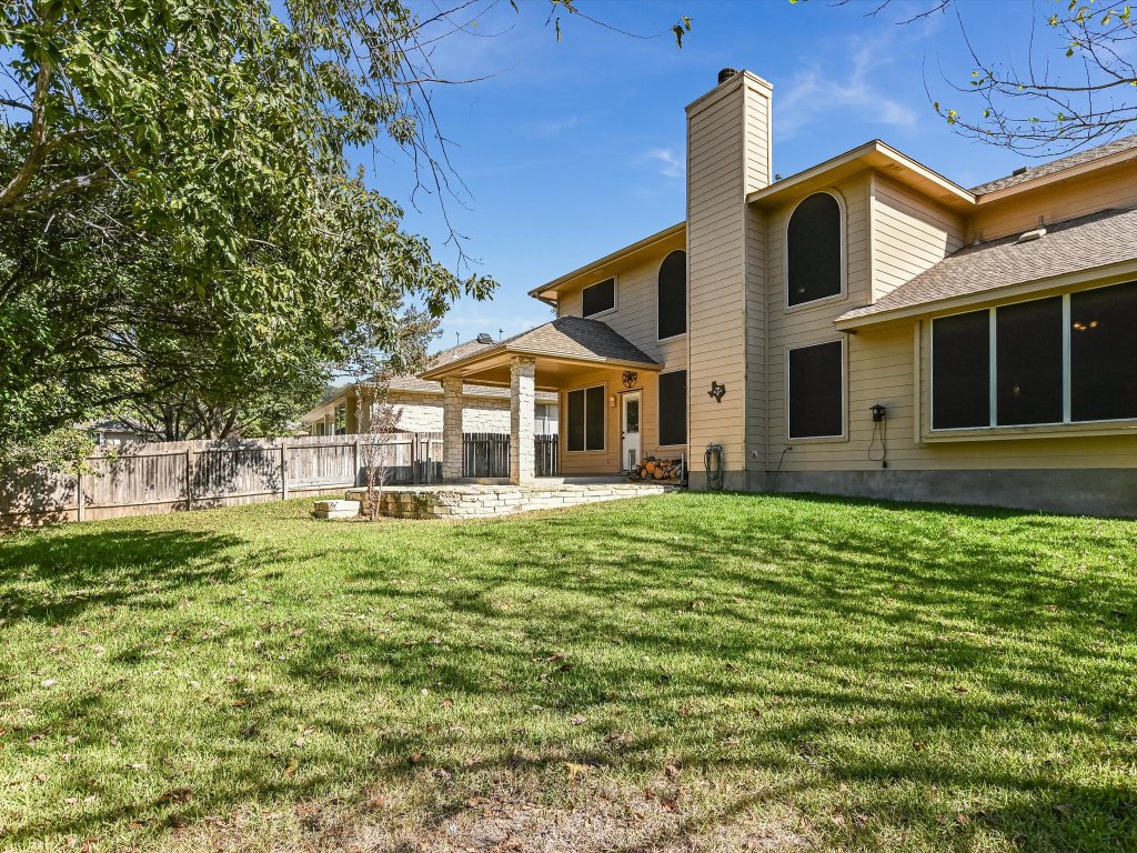 19910 Kennemer Drive Pflugerville, TX 78660 - Photo 19 of 21 a front view of a house with a garden