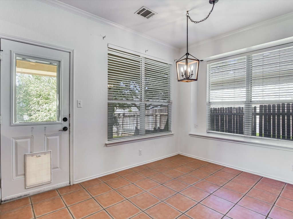 19910 Kennemer Drive Pflugerville, TX 78660 - Photo 7 of 21 a view of an empty room with a window