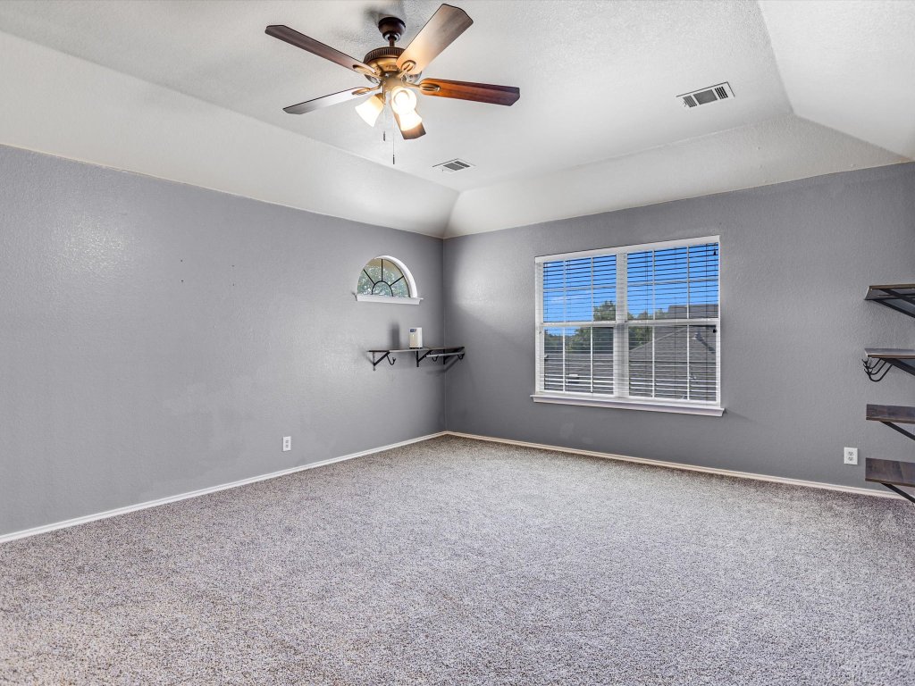 19910 Kennemer Drive Pflugerville, TX 78660 - Photo 9 of 21 a view of an empty room with a window