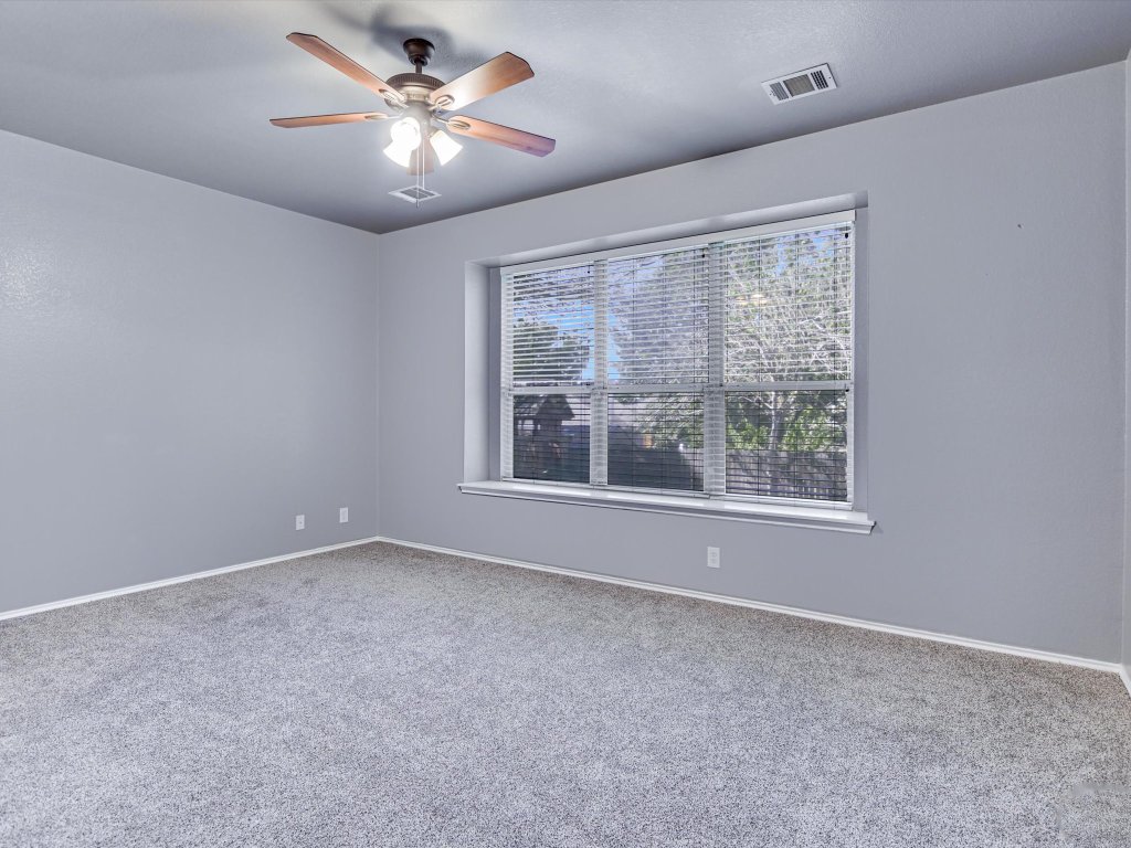 19910 Kennemer Drive Pflugerville, TX 78660 - Photo 10 of 21 a view of an empty room with a window