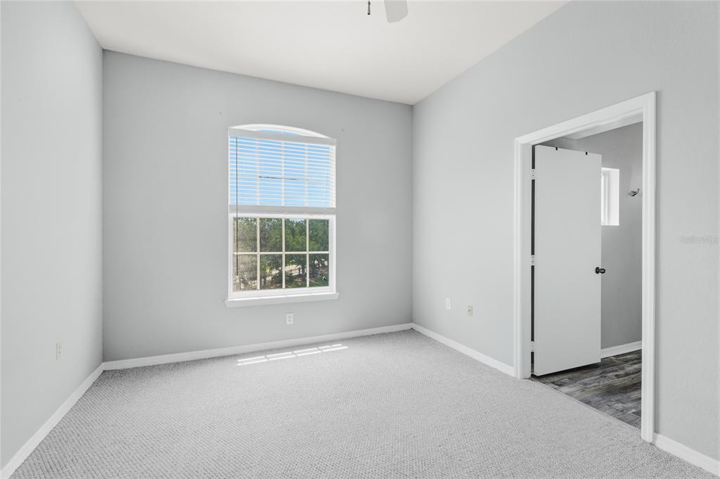 5122 Northridge Road, Unit 307 Sarasota, FL 34238 - Photo 17 of 51 an empty room with a window