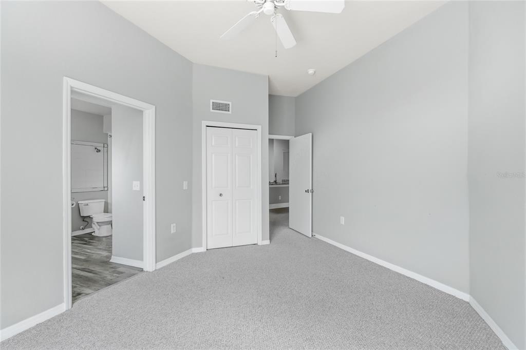 5122 Northridge Road, Unit 307 Sarasota, FL 34238 - Photo 18 of 51 an empty room with a bathroom and a hallway