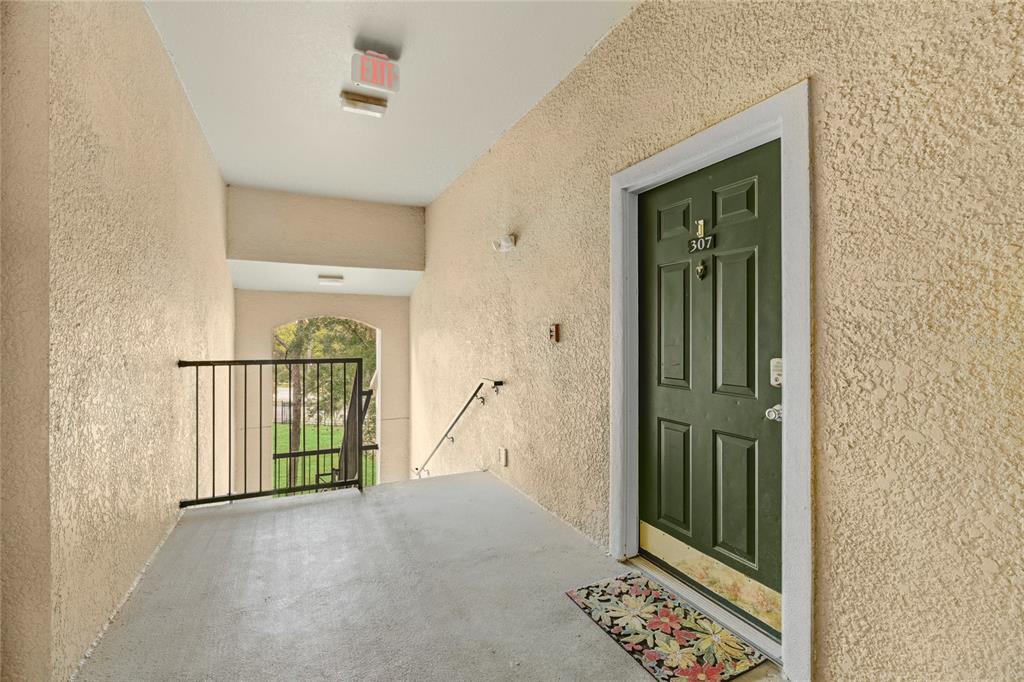 5122 Northridge Road, Unit 307 Sarasota, FL 34238 - Photo 2 of 51 a view of entryway with staircase