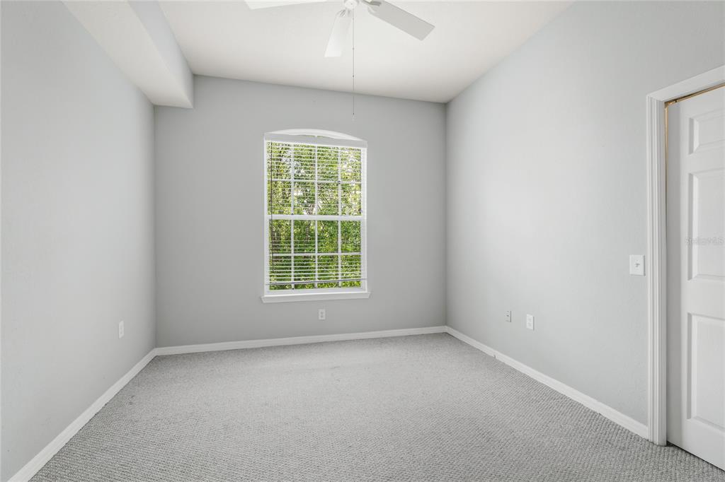 5122 Northridge Road, Unit 307 Sarasota, FL 34238 - Photo 21 of 51 an empty room with a window