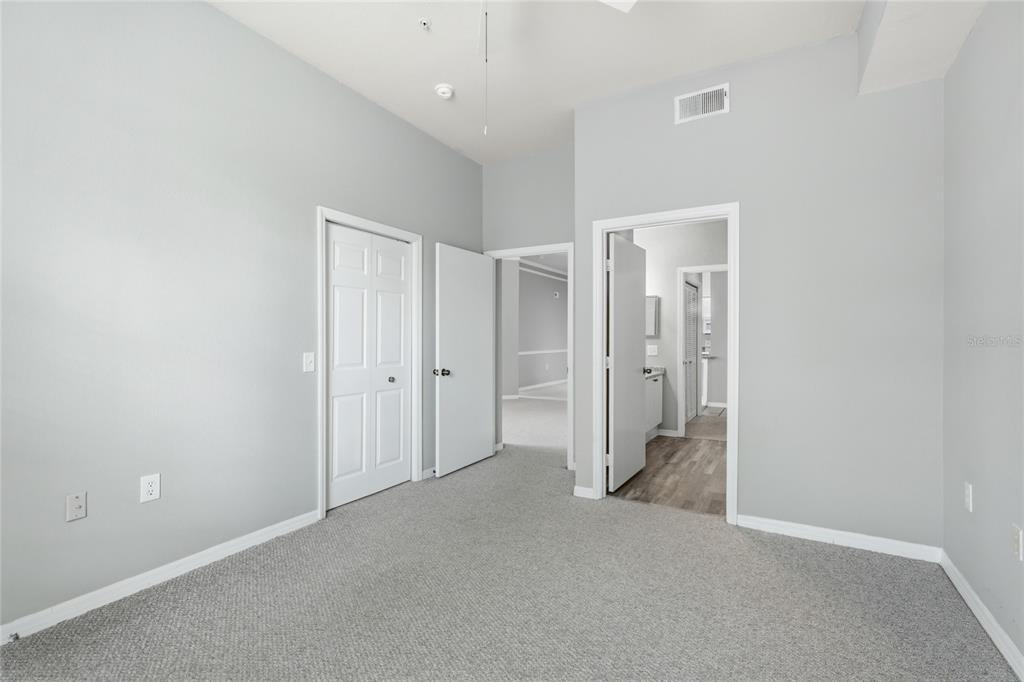 5122 Northridge Road, Unit 307 Sarasota, FL 34238 - Photo 22 of 51 an empty room with closet and a bathroom