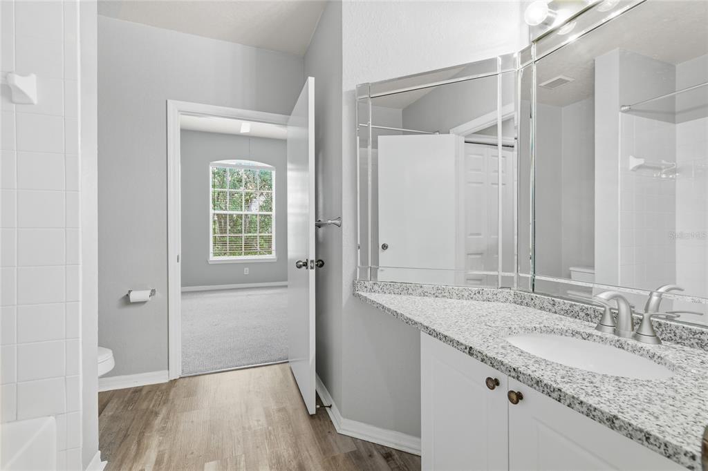 5122 Northridge Road, Unit 307 Sarasota, FL 34238 - Photo 25 of 51 a bathroom with a granite countertop sink and a mirror