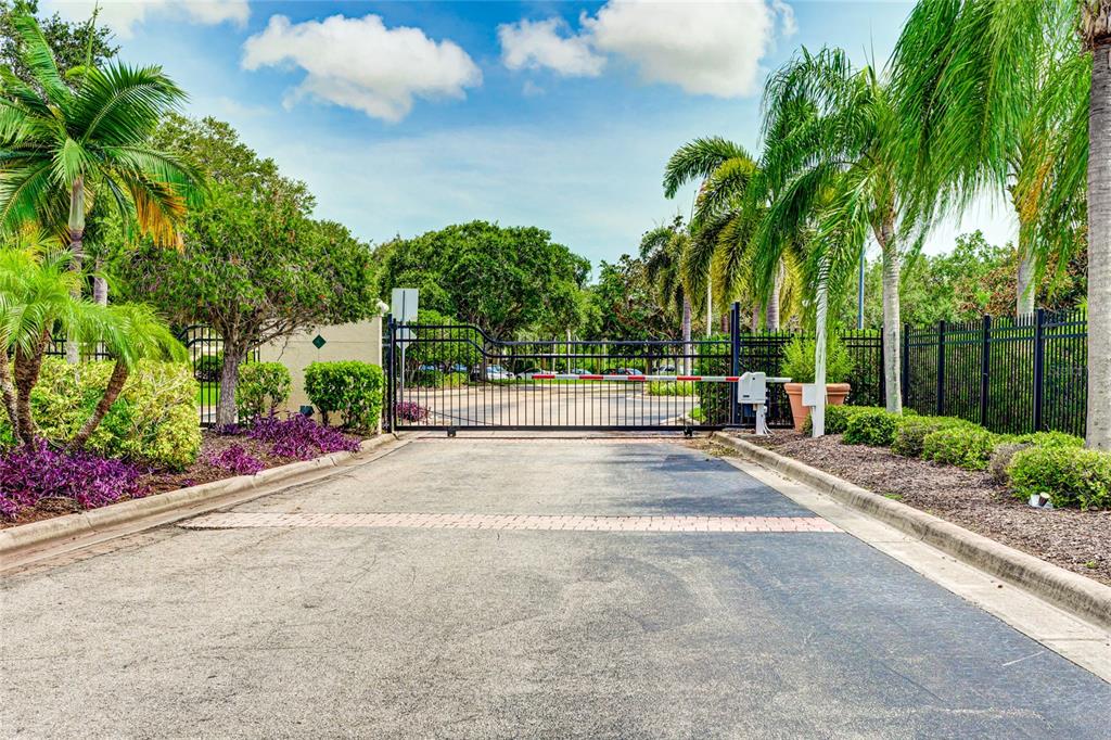 5122 Northridge Road, Unit 307 Sarasota, FL 34238 - Photo 30 of 51 a view of a street with a building in the background