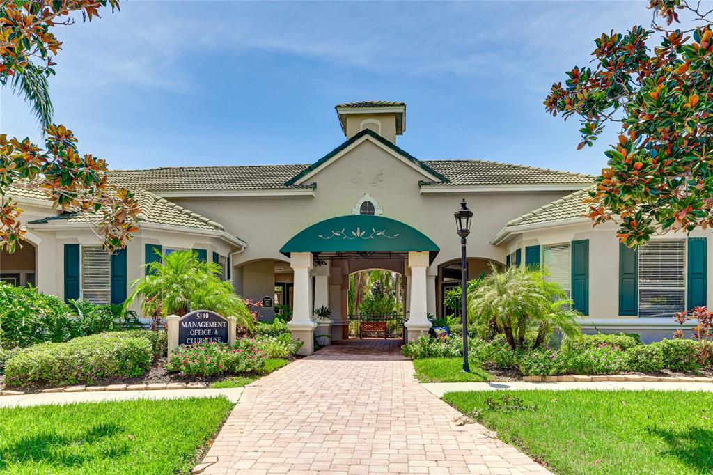 5122 Northridge Road, Unit 307 Sarasota, FL 34238 - Photo 32 of 51 a front view of a house with garden
