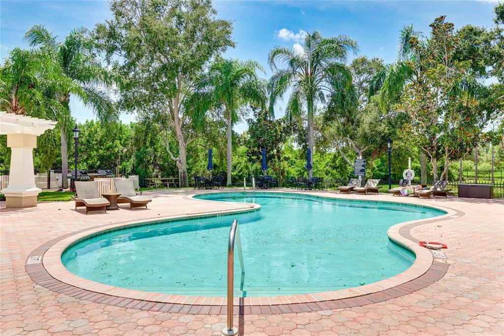 5122 Northridge Road, Unit 307 Sarasota, FL 34238 - Photo 33 of 51 a view of a swimming pool with a patio