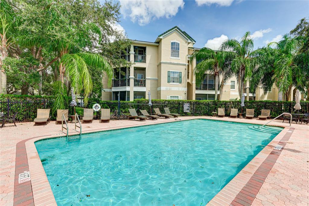 5122 Northridge Road, Unit 307 Sarasota, FL 34238 - Photo 47 of 51 a view of a house with swimming pool and sitting area