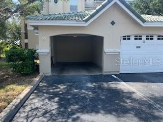 5122 Northridge Road, Unit 307 Sarasota, FL 34238 - Photo 49 of 51 a view of outdoor space garage and window