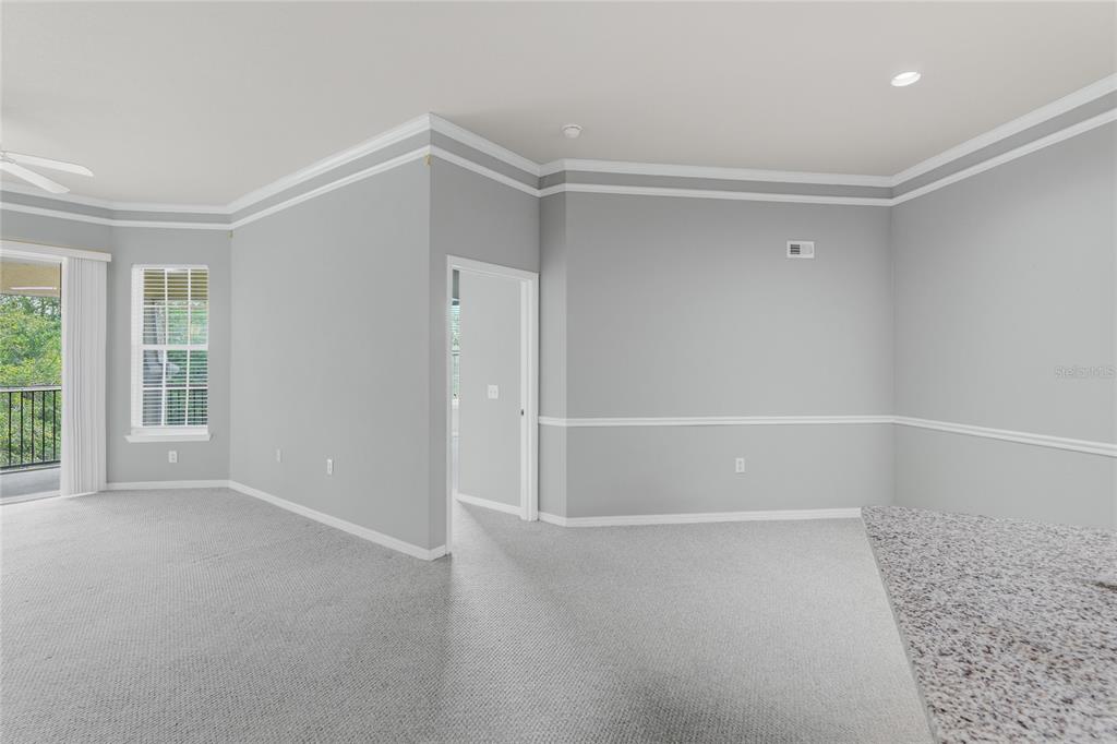 5122 Northridge Road, Unit 307 Sarasota, FL 34238 - Photo 6 of 51 a view of an empty room with a window