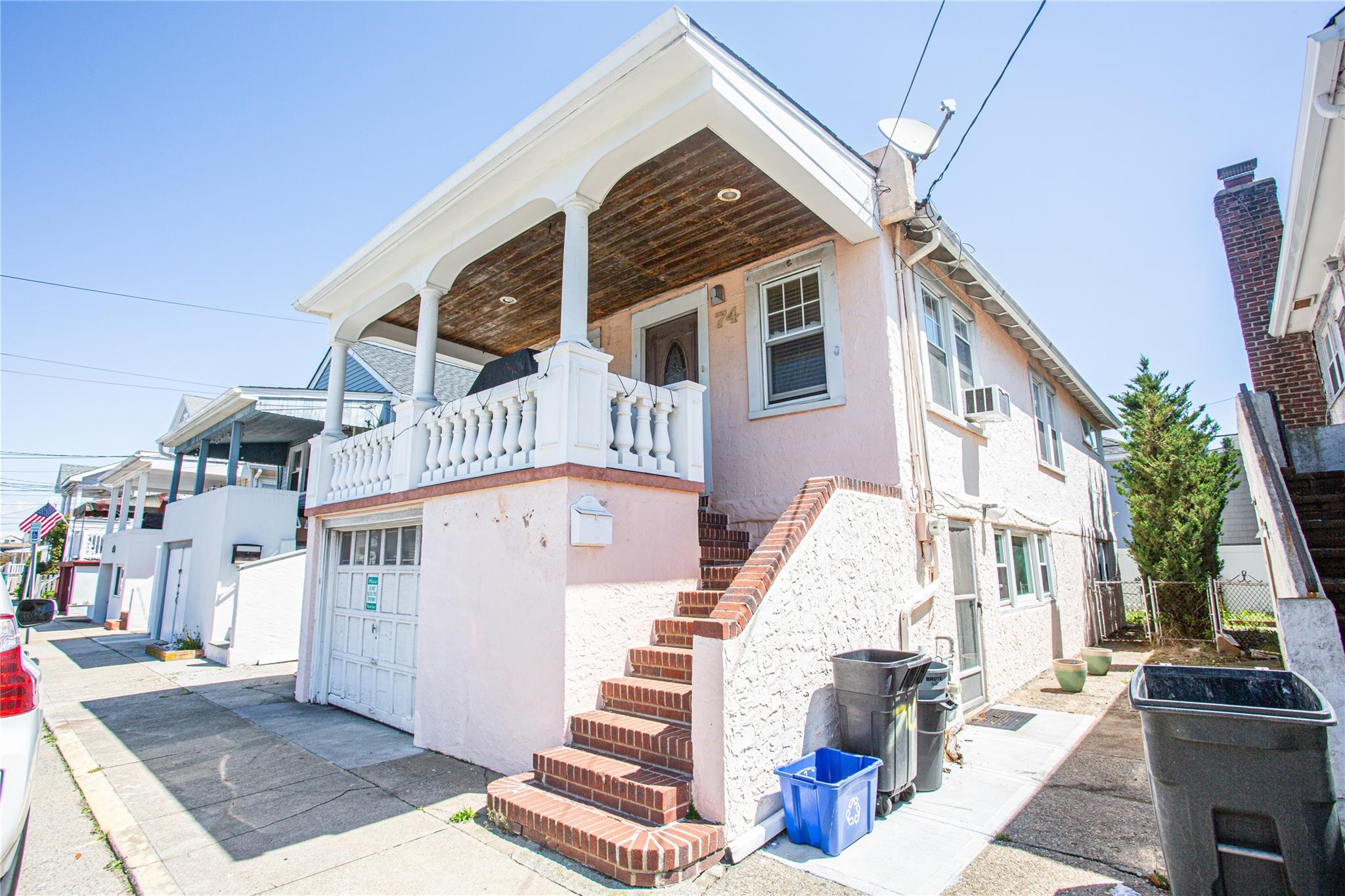 74 Rochester Avenue East Atlantic Beach, NY 11561 - Photo 1 of 1 a view of a building with a bench