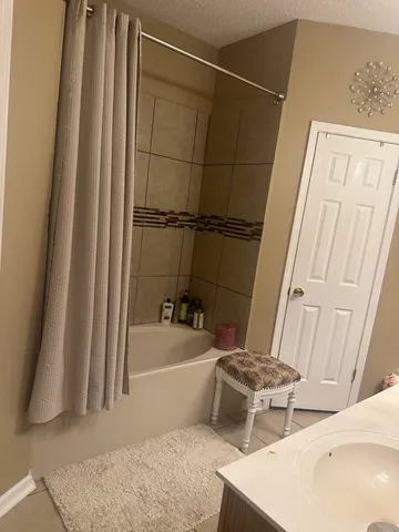 a bathroom with a sink and a bathtub