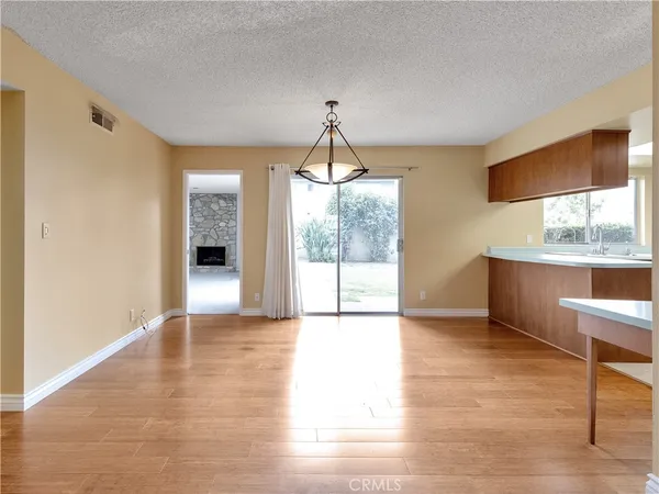 a kitchen with stainless steel appliances granite countertop a sink and a stove