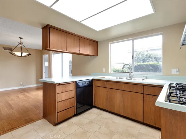 a kitchen with stainless steel appliances granite countertop a sink and cabinets