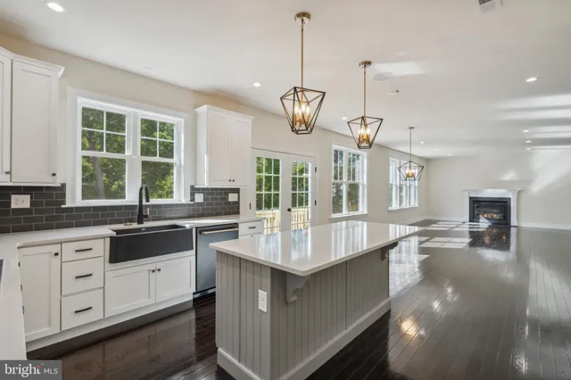 a kitchen with center island and windows