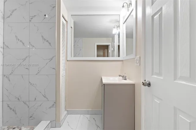 a bathroom with a sink and mirror