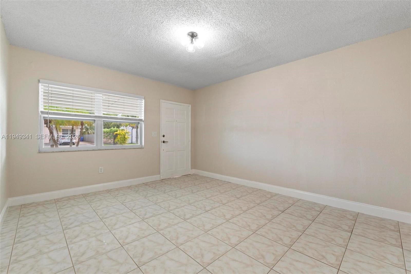 3507 Southwest 25th Terrace Miami, FL 33133 - Photo 5 of 32 an empty room with windows