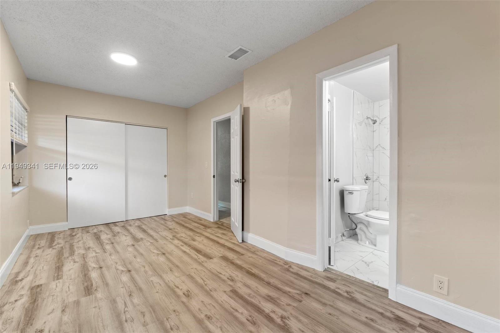 3507 Southwest 25th Terrace Miami, FL 33133 - Photo 8 of 32 a view of empty room with wooden floor