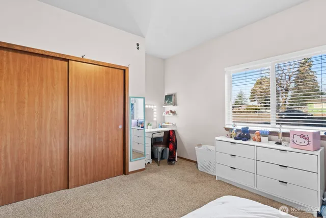 a bedroom with a bed furniture and a window
