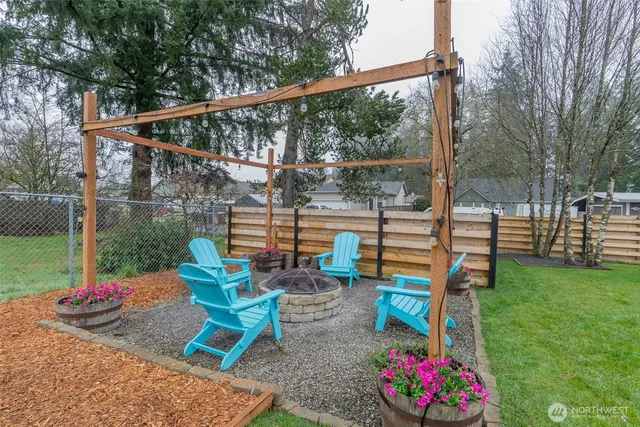 a view of a house with backyard and porch
