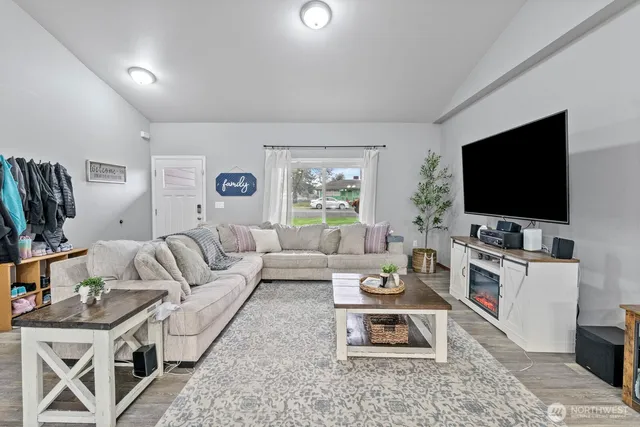 a living room with furniture and a flat screen tv