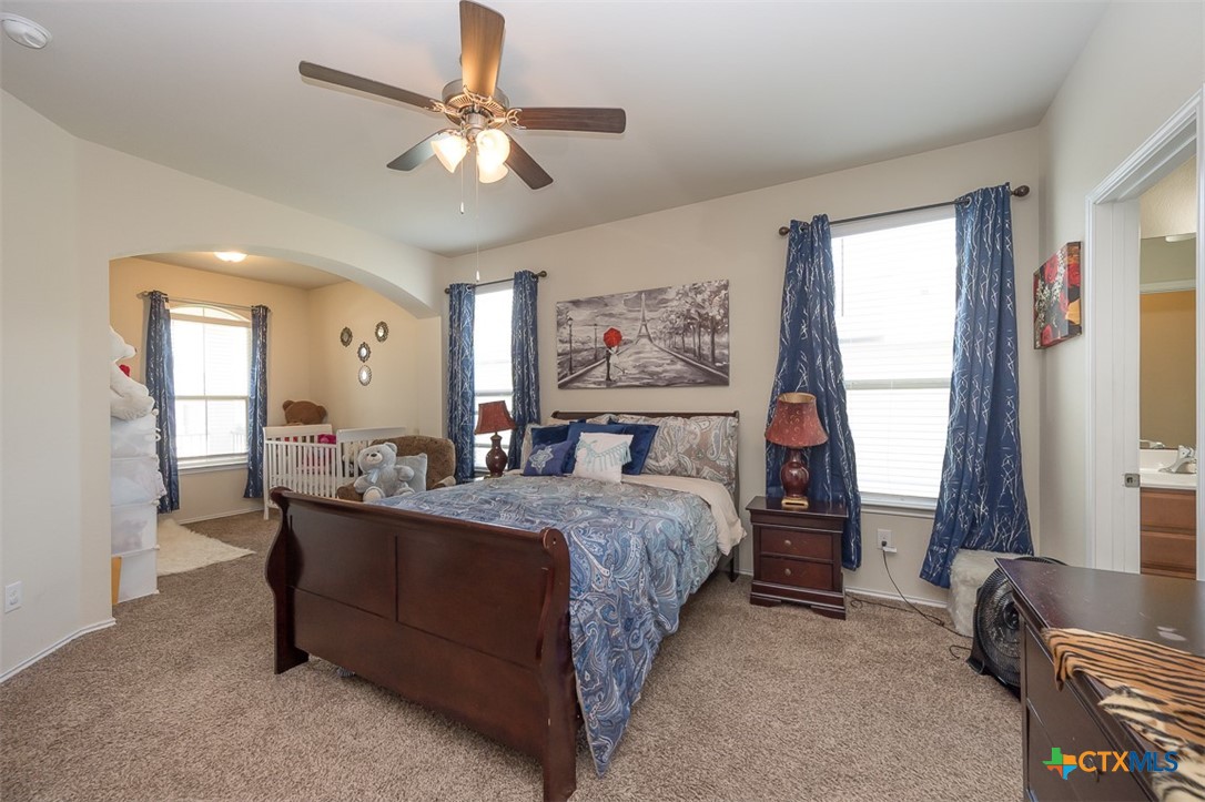 2511 Pintail Loop Copperas Cove, TX 76522 - Photo 14 of 26 a bedroom with a bed and a couch