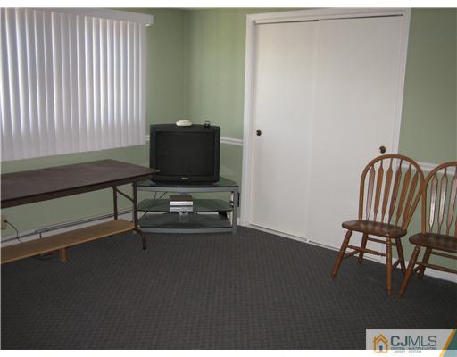 16 Altamont Road Edison, NJ 08817 - Photo 11 of 16 a view of a workspace with furniture and a window