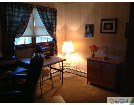 16 Altamont Road Edison, NJ 08817 - Photo 8 of 16 a living room with furniture and a window