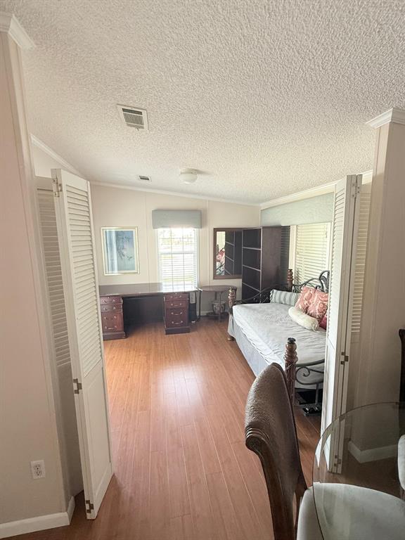 2090 Southwest 85th Avenue Davie, FL 33324 - Photo 13 of 37 a bedroom with furniture and a wooden floor