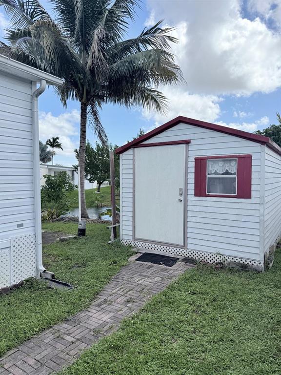 2090 Southwest 85th Avenue Davie, FL 33324 - Photo 20 of 37 a view of a house with a yard
