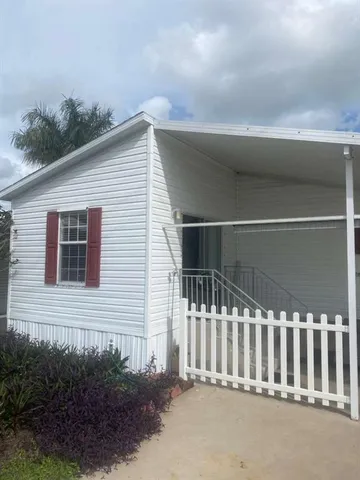 a view of a house with a small yard