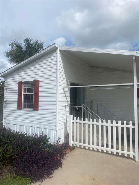 2090 Southwest 85th Avenue Davie, FL 33324 - Photo 2 of 37 a view of a house with a small yard