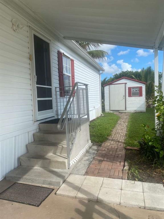 2090 Southwest 85th Avenue Davie, FL 33324 - Photo 25 of 37 a view of a house with a yard