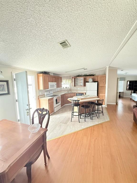 2090 Southwest 85th Avenue Davie, FL 33324 - Photo 3 of 37 a living room with furniture a dining table and chairs with wooden floor
