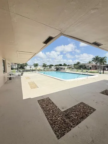 an outdoor space with lounge chair