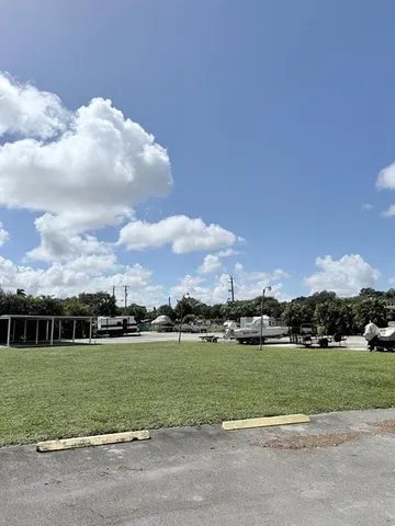 a view of a golf course with a house
