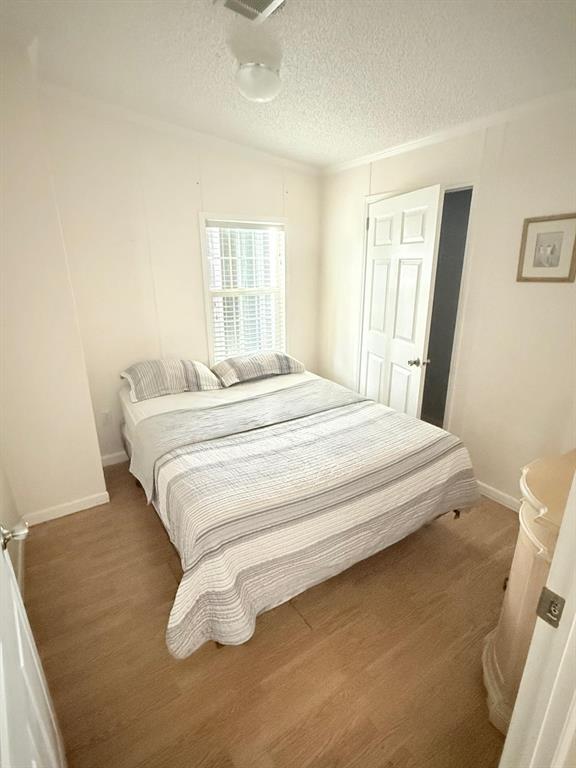 2090 Southwest 85th Avenue Davie, FL 33324 - Photo 8 of 37 a bedroom with a bed and a window