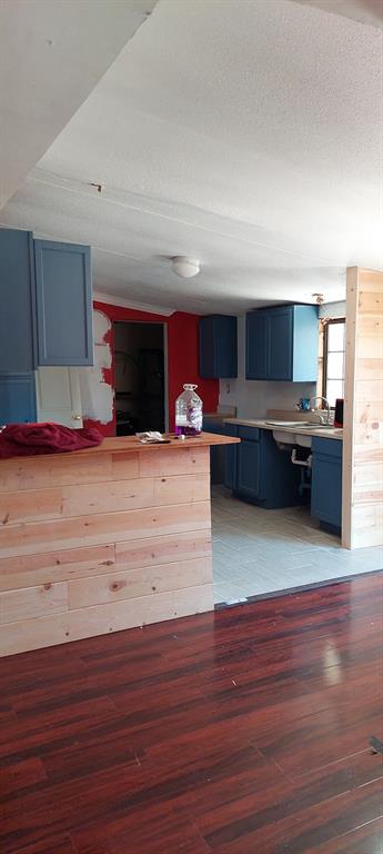 516 Private Road 2308 Quinlan, TX 75474 - Photo 11 of 13 a living room with kitchen island granite countertop wooden floor large window and furniture