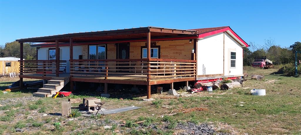 516 Private Road 2308 Quinlan, TX 75474 - Photo 2 of 13 a front view of a house with a yard