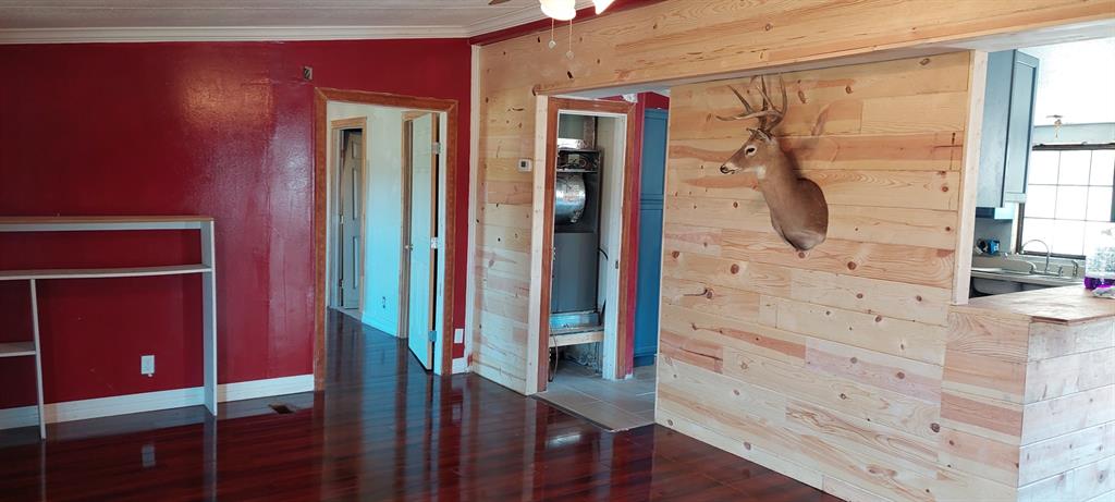 516 Private Road 2308 Quinlan, TX 75474 - Photo 5 of 13 a view of a hallway with wooden floor and staircase