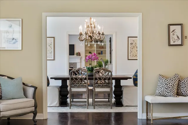 a view of a dining room with furniture and chandelier