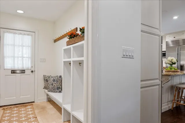 walk in closet with window and a kitchen
