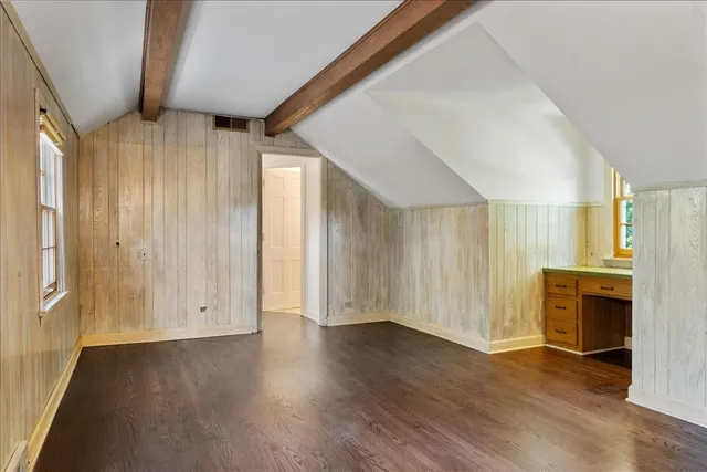 wooden floor in an empty room with a fireplace