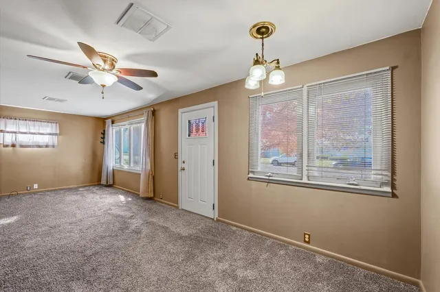 a view of an empty room with a window