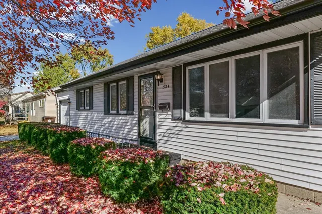 a view of a house with a flower garden