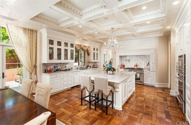 a bedroom with a bed couch and a large window