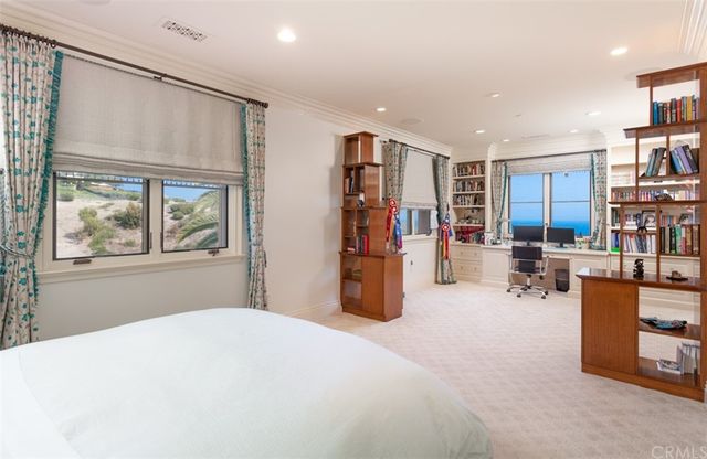 a view of a patio with couches table and chairs with swimming pool and outdoor view